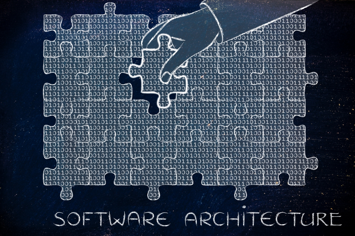 Software Architecture - Immagine grafica che mostra un disegno: si vede la mano di una persona che compone un puzzle